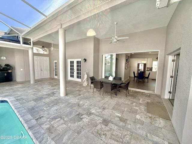 1811 N Central Ave, Flagler Beach, FL 32136 - view of patio with ceiling fan, an outdoor pool, french doors, glass enclosure, and outdoor dining space