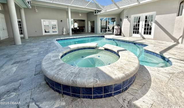 1811 N Central Ave, Flagler Beach, FL 32136 - view of pool with a patio, a lanai, a pool with connected hot tub, and french doors