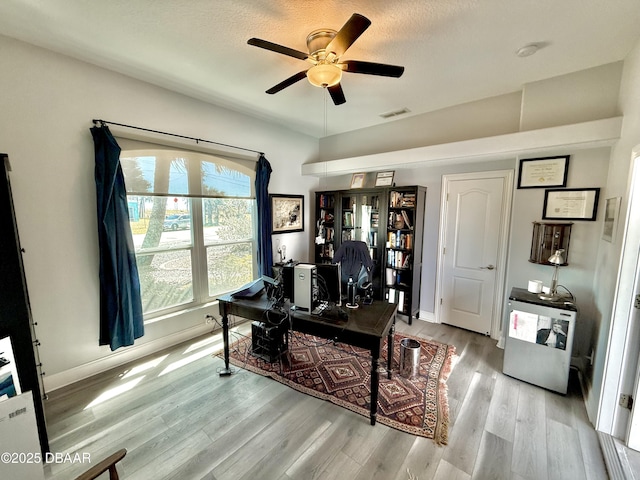 1811 N Central Ave, Flagler Beach, FL 32136 - office space featuring a ceiling fan, a textured ceiling, visible vents, wood finished floors, and baseboards