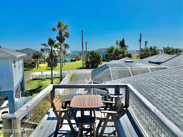 1811 N Central Ave, Flagler Beach, FL 32136 - wooden deck featuring glass enclosure and outdoor dining space