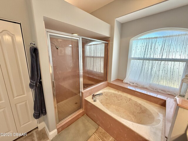 1811 N Central Ave, Flagler Beach, FL 32136 - full bathroom with tile patterned floors, a bath, and a shower stall
