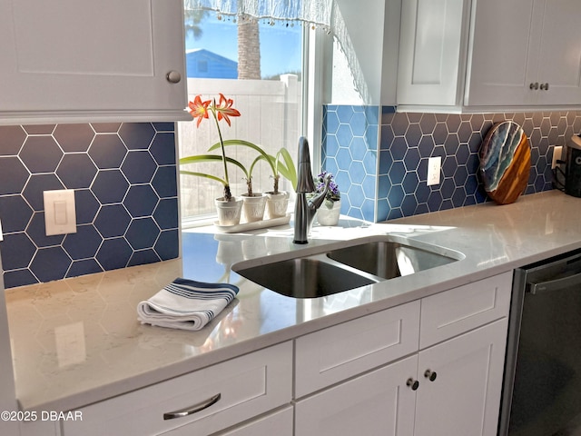 1811 N Central Ave, Flagler Beach, FL 32136 - kitchen with a sink, tasteful backsplash, dishwashing machine, and white cabinetry