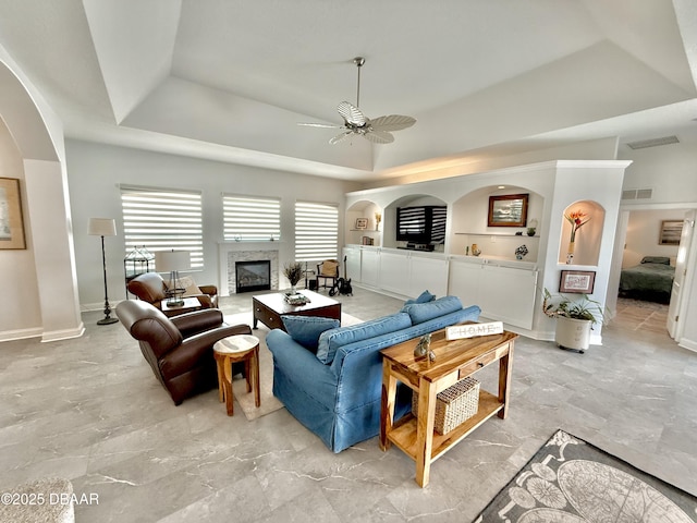 1811 N Central Ave, Flagler Beach, FL 32136 - living area featuring a ceiling fan, visible vents, a glass covered fireplace, and a healthy amount of sunlight