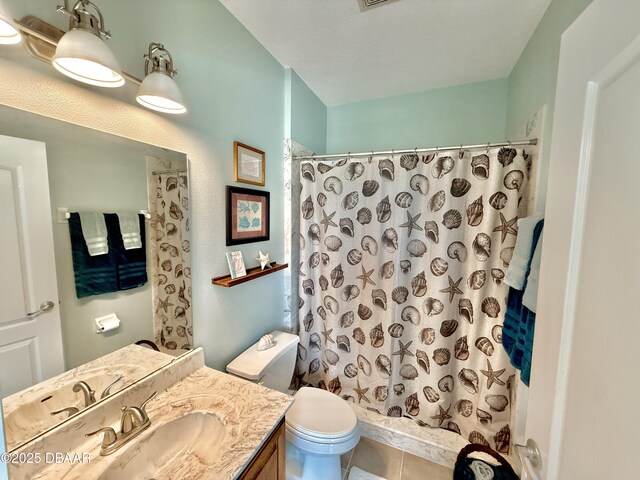 1811 N Central Ave, Flagler Beach, FL 32136 - full bath featuring vanity, tile patterned flooring, curtained shower, and toilet