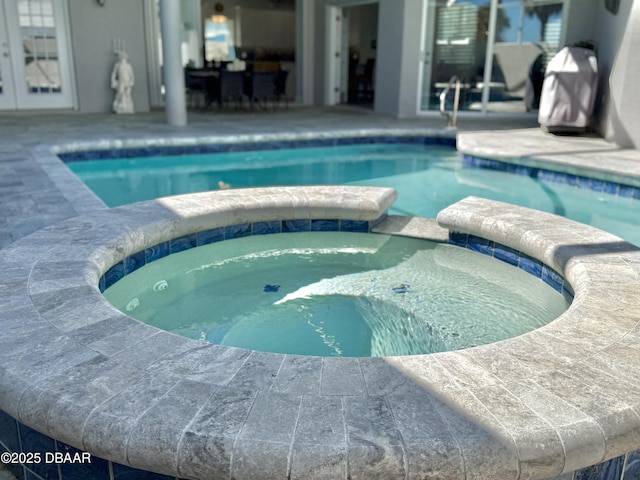 1811 N Central Ave, Flagler Beach, FL 32136 - view of pool featuring a patio area and a pool with connected hot tub