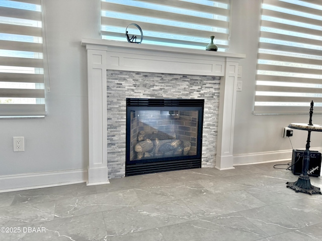 1811 N Central Ave, Flagler Beach, FL 32136 - room details featuring baseboards and a glass covered fireplace