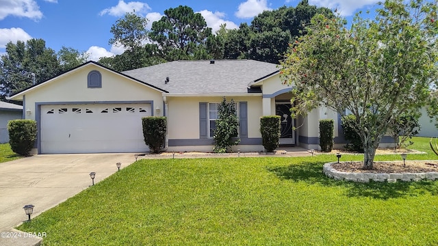 ranch-style home with a garage and a front yard