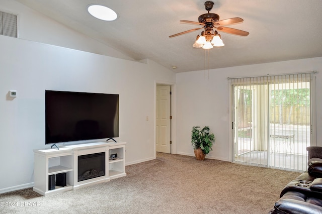 carpeted living room featuring lofted ceiling and ceiling fan