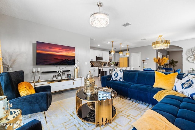 living room with a notable chandelier