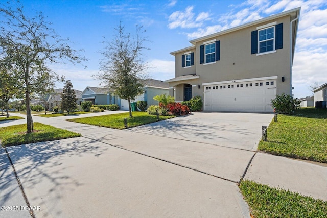 view of front facade with a garage and a front yard