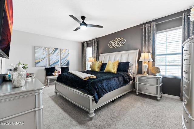 bedroom with multiple windows, carpet floors, and ceiling fan