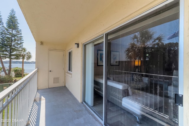 balcony featuring a water view