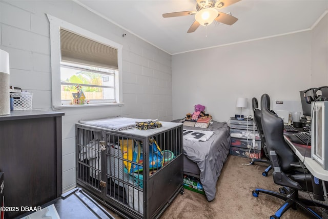 1052 Tompkins Dr, Port Orange, FL 32129 - bedroom with ornamental molding, an office area, carpet flooring, concrete block wall, and ceiling fan