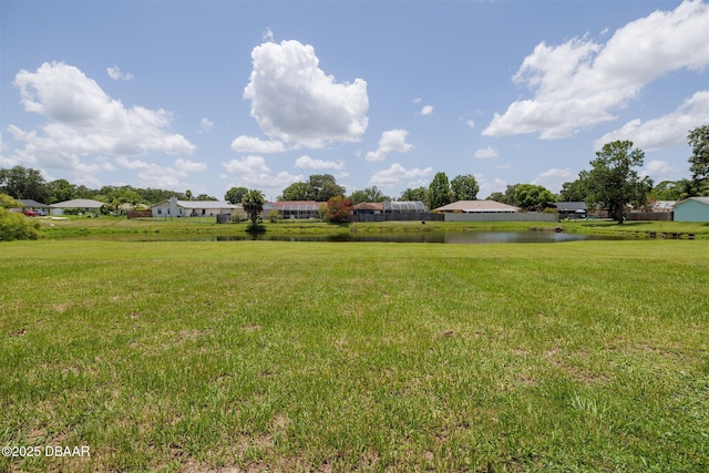 1052 Tompkins Dr, Port Orange, FL 32129 - view of grassy yard with a water view