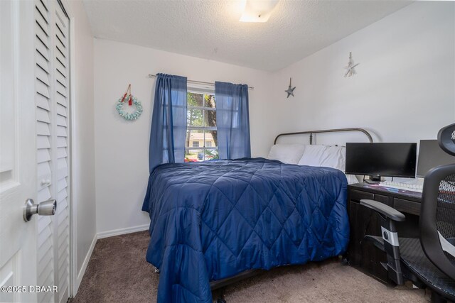 1052 Tompkins Dr, Port Orange, FL 32129 - bedroom with carpet floors, a textured ceiling, and a desk