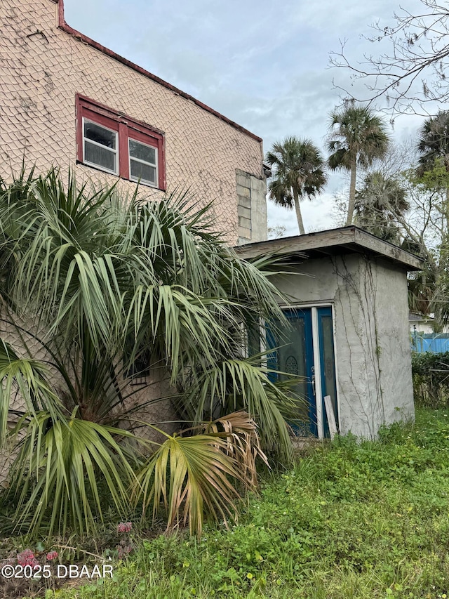 view of property exterior with stucco siding