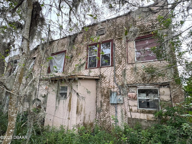 view of property exterior with stucco siding