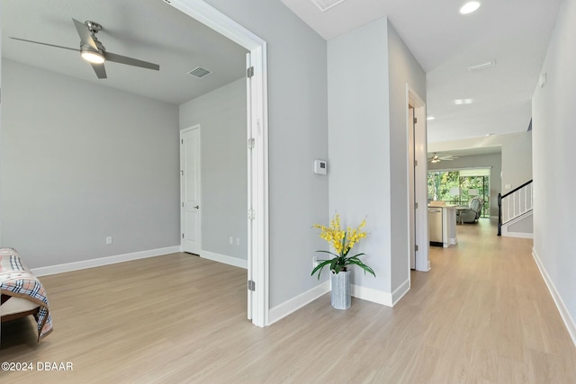 hall with light wood-type flooring