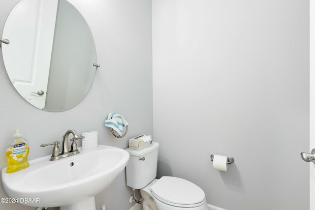 bathroom with sink and toilet