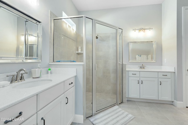 bathroom featuring vanity, tile patterned floors, and a shower with door