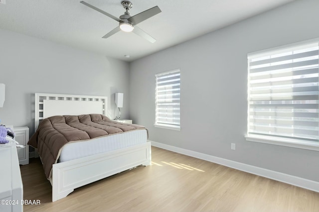 bedroom featuring ceiling fan and light hardwood / wood-style floors