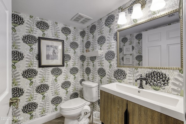 1 John Anderson Dr Unit 103, Ormond Beach, FL 32176 - half bath featuring wallpapered walls and vanity