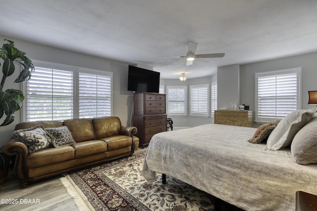 1 John Anderson Dr Unit 103, Ormond Beach, FL 32176 - bedroom with light wood-type flooring and ceiling fan