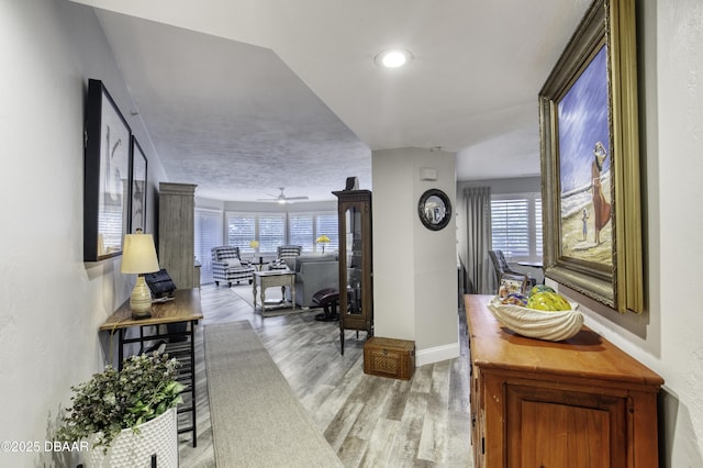 1 John Anderson Dr Unit 103, Ormond Beach, FL 32176 - hall with beverage cooler, wood finished floors, plenty of natural light, and recessed lighting