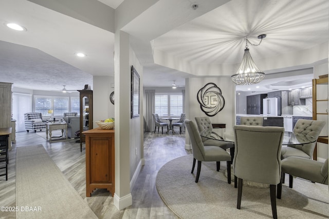 1 John Anderson Dr Unit 103, Ormond Beach, FL 32176 - dining space with light wood-style flooring, a chandelier, recessed lighting, and ceiling fan