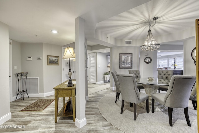 1 John Anderson Dr Unit 103, Ormond Beach, FL 32176 - dining area with light wood-style floors, a chandelier, and recessed lighting