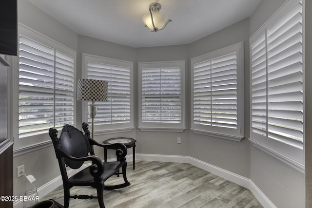 1 John Anderson Dr Unit 103, Ormond Beach, FL 32176 - sitting room featuring wood finished floors and baseboards