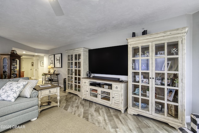 1 John Anderson Dr Unit 103, Ormond Beach, FL 32176 - living room featuring light wood-style floors and ceiling fan