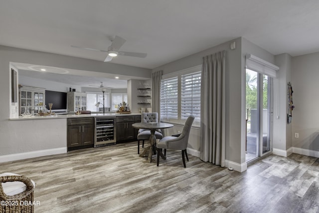 1 John Anderson Dr Unit 103, Ormond Beach, FL 32176 - indoor wet bar featuring beverage cooler, light wood-style floors, ceiling fan, and recessed lighting