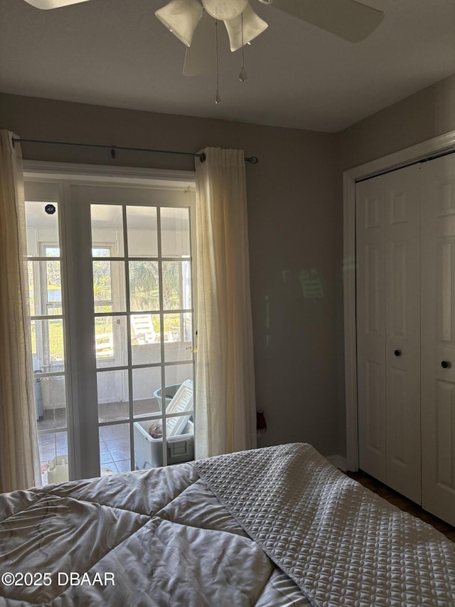 bedroom with ceiling fan and a closet