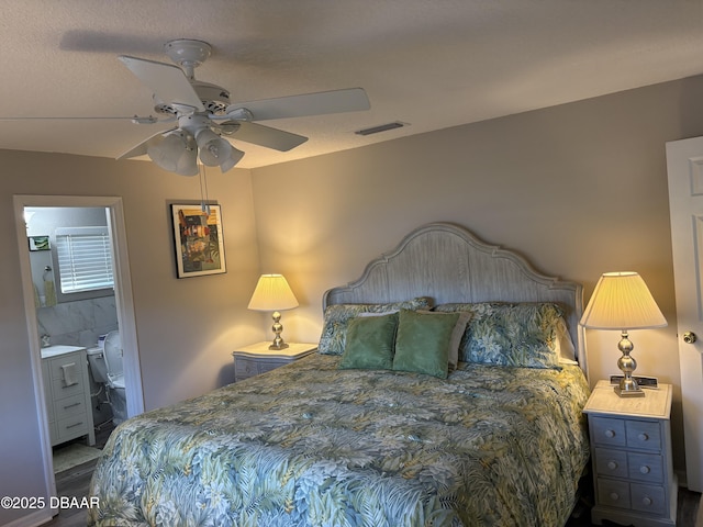 bedroom featuring ceiling fan and connected bathroom