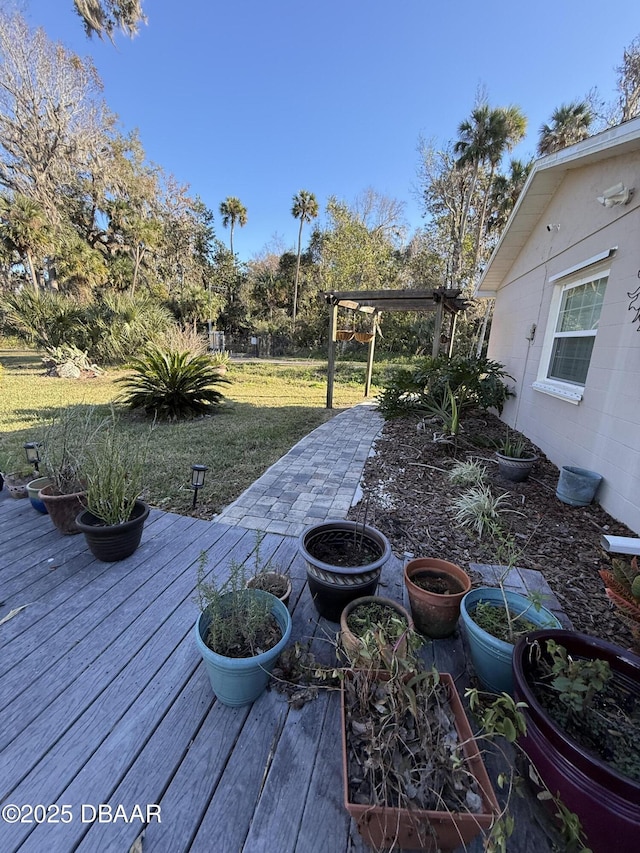 view of yard featuring a wooden deck and a pergola