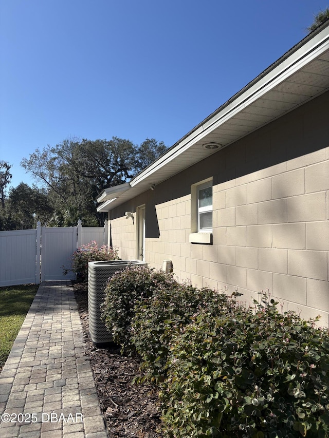 view of side of home featuring central air condition unit