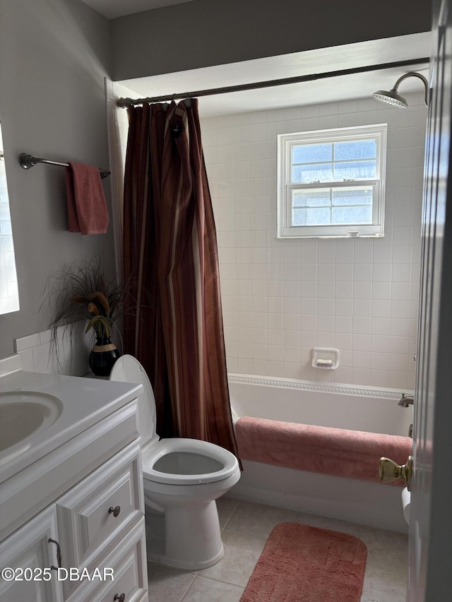 full bathroom with shower / tub combo, vanity, tile patterned flooring, and toilet