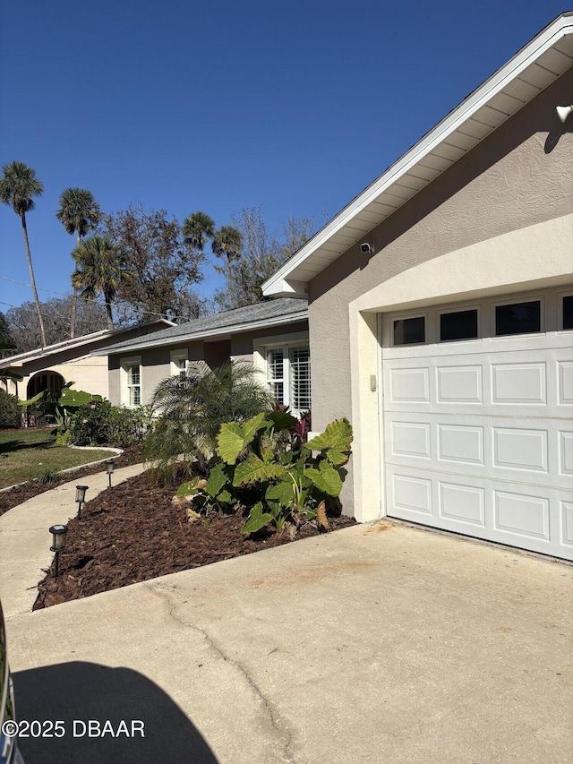 ranch-style home with a garage