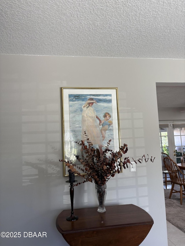 room details with a textured ceiling and carpet