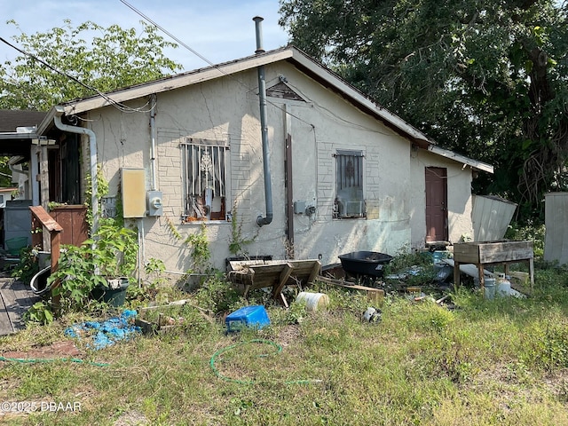 1226 Bender Ave, Holly Hill, FL 32117 - rear view of property with stucco siding