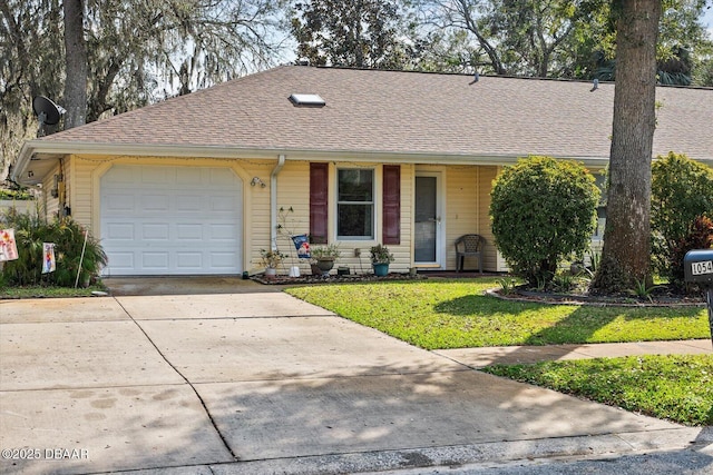 ranch-style house with a garage and a front yard