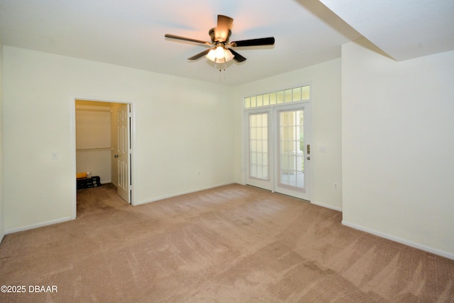 carpeted empty room with ceiling fan