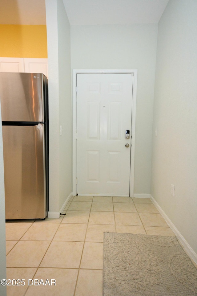 doorway featuring light tile patterned floors