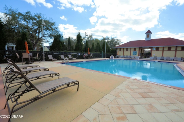 view of swimming pool featuring a patio area