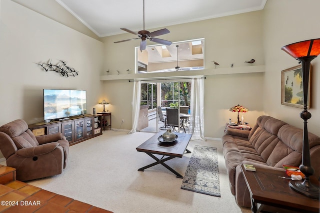 carpeted living room featuring ceiling fan, ornamental molding, and high vaulted ceiling