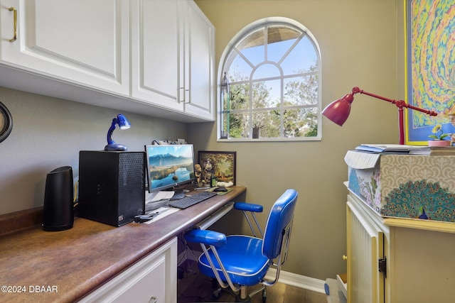 office space with wood-type flooring