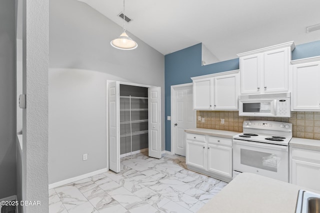 kitchen with white appliances, marble finish floor, light countertops, white cabinetry, and backsplash