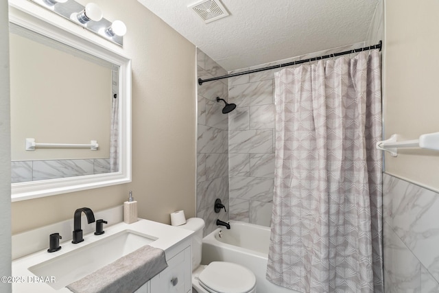 bathroom with visible vents, toilet, shower / bath combo, a textured ceiling, and vanity