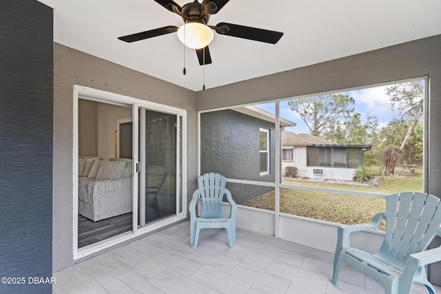 sunroom / solarium with ceiling fan